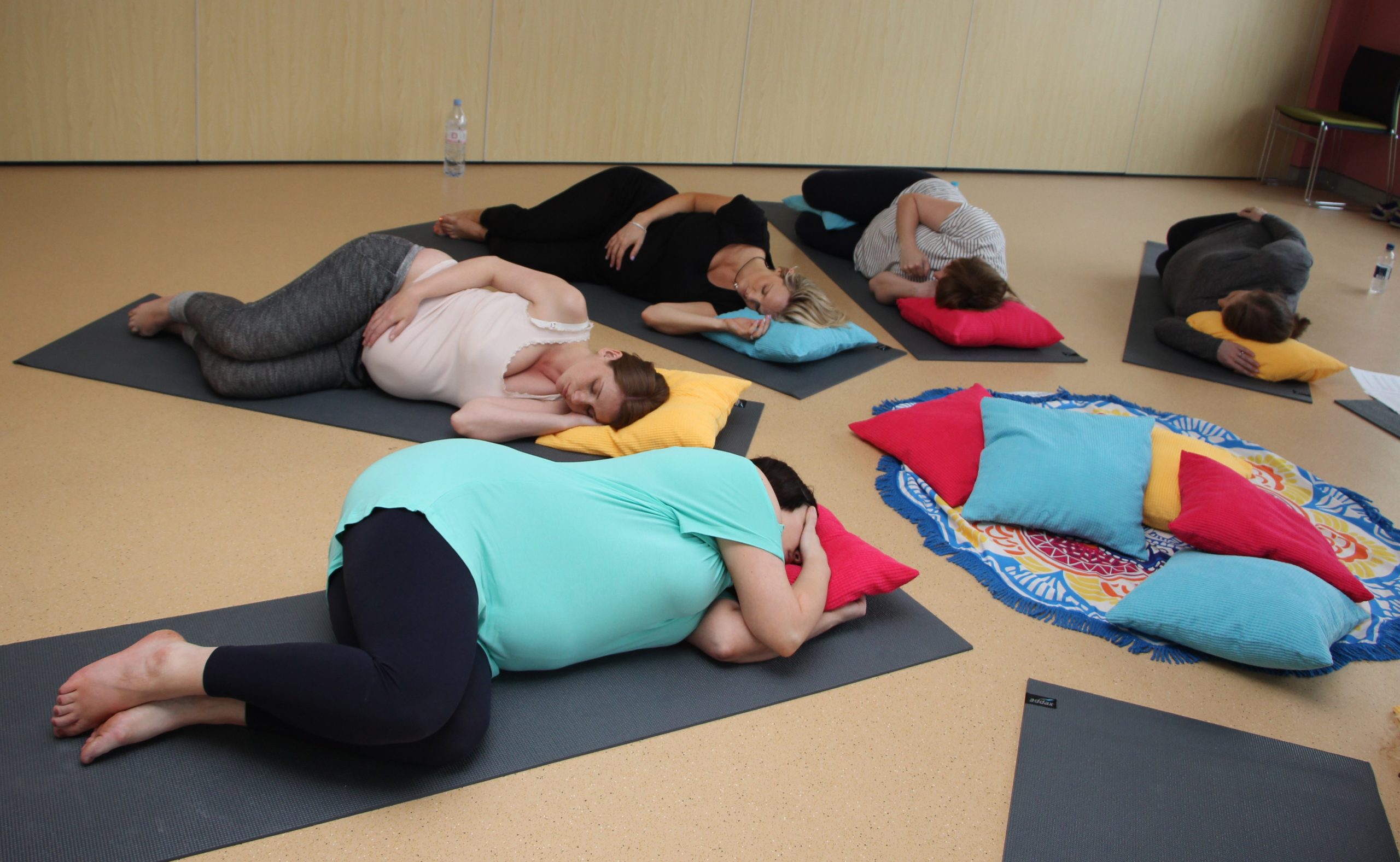 Mum's-to-be relaxing in a prenatal yoga class