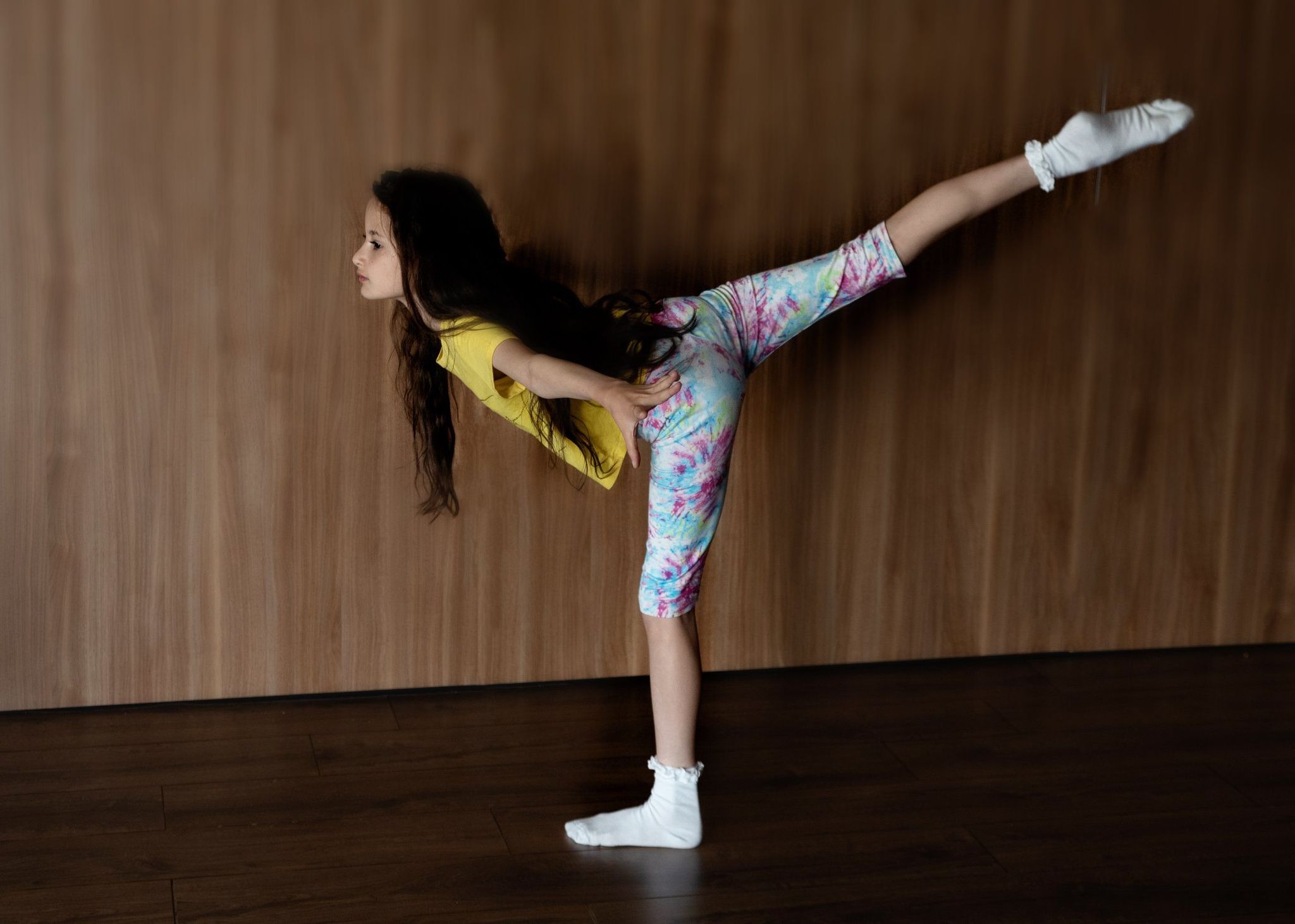 Girl in a one-legged pose to improve balance