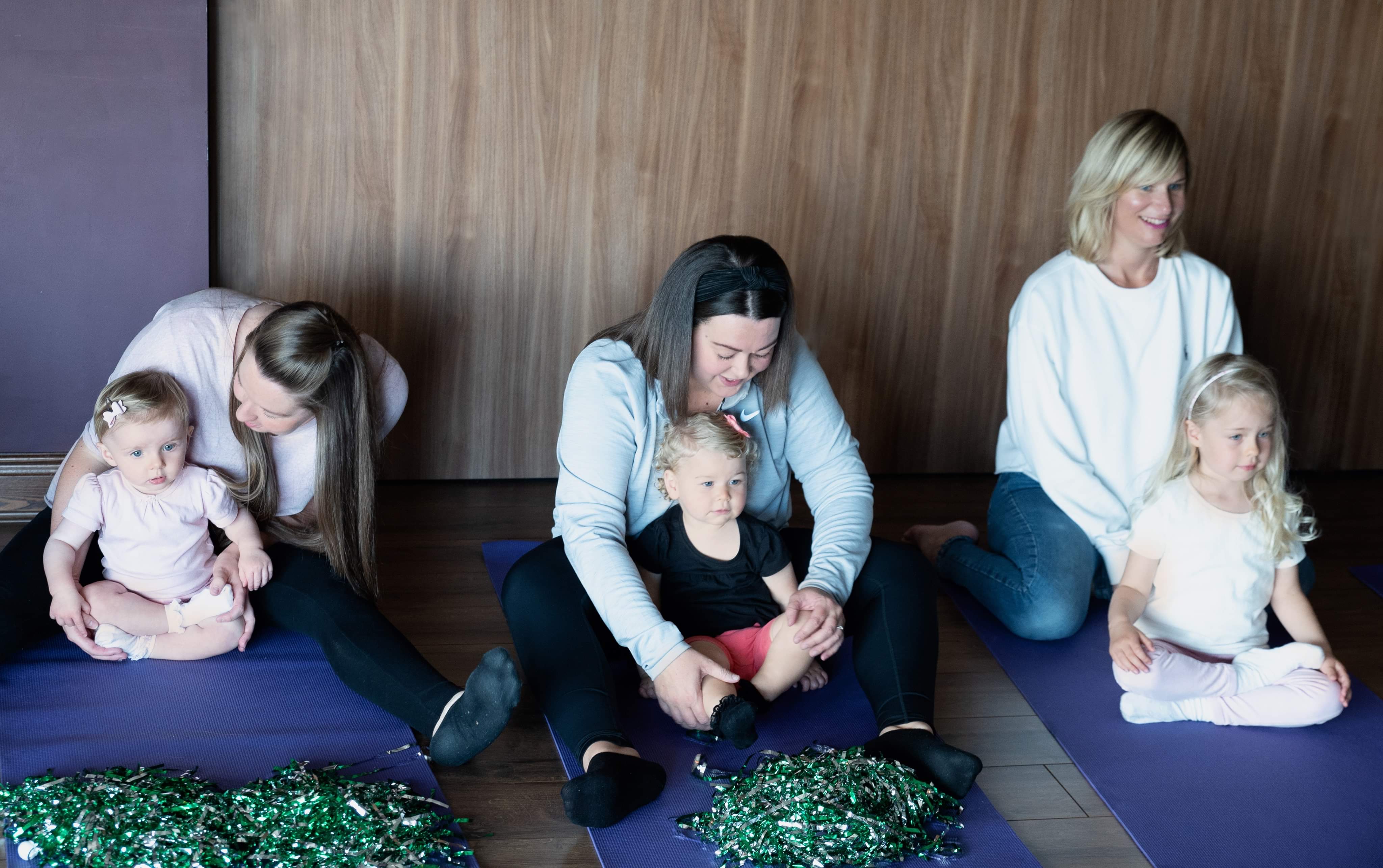 2 pre-school children taking part in a yoga class