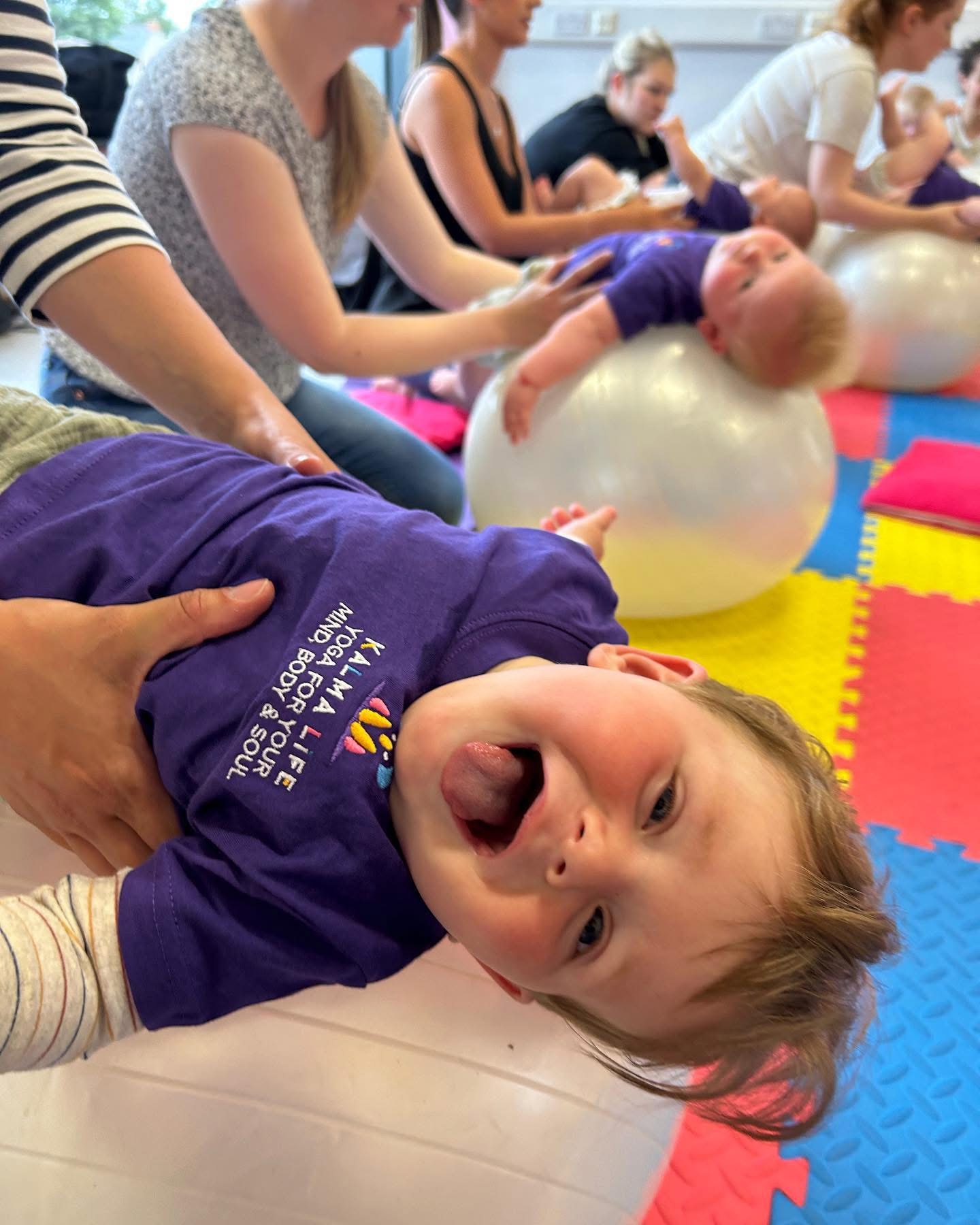3 children balancing on one leg in yoga pose